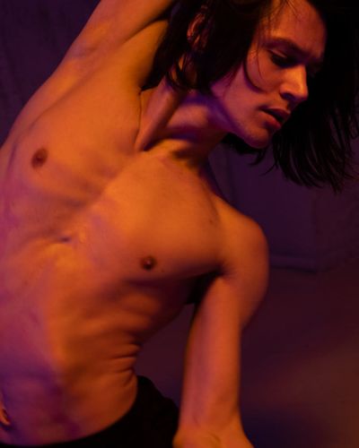 Male performing functional movements for body tone